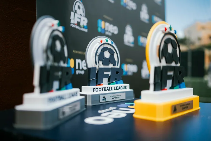 IFR Football League trophies displayed beside event branding