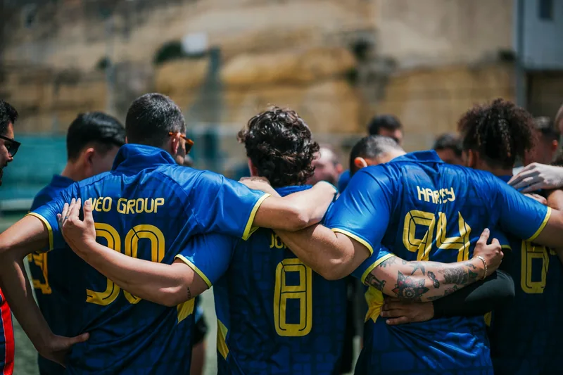 Neo Group players come together in a team huddle