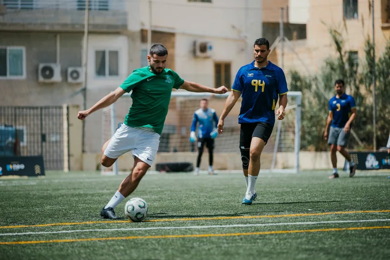 An Enteractive player strikes the ball during the IFR Football League finals