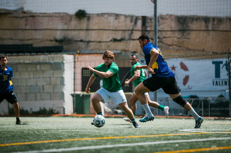 Neo Group and Enteractive players compete at the IFR Football League finals