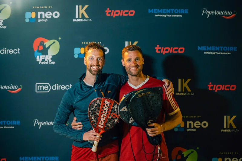 Two Tipico players celebrate together with their trophies