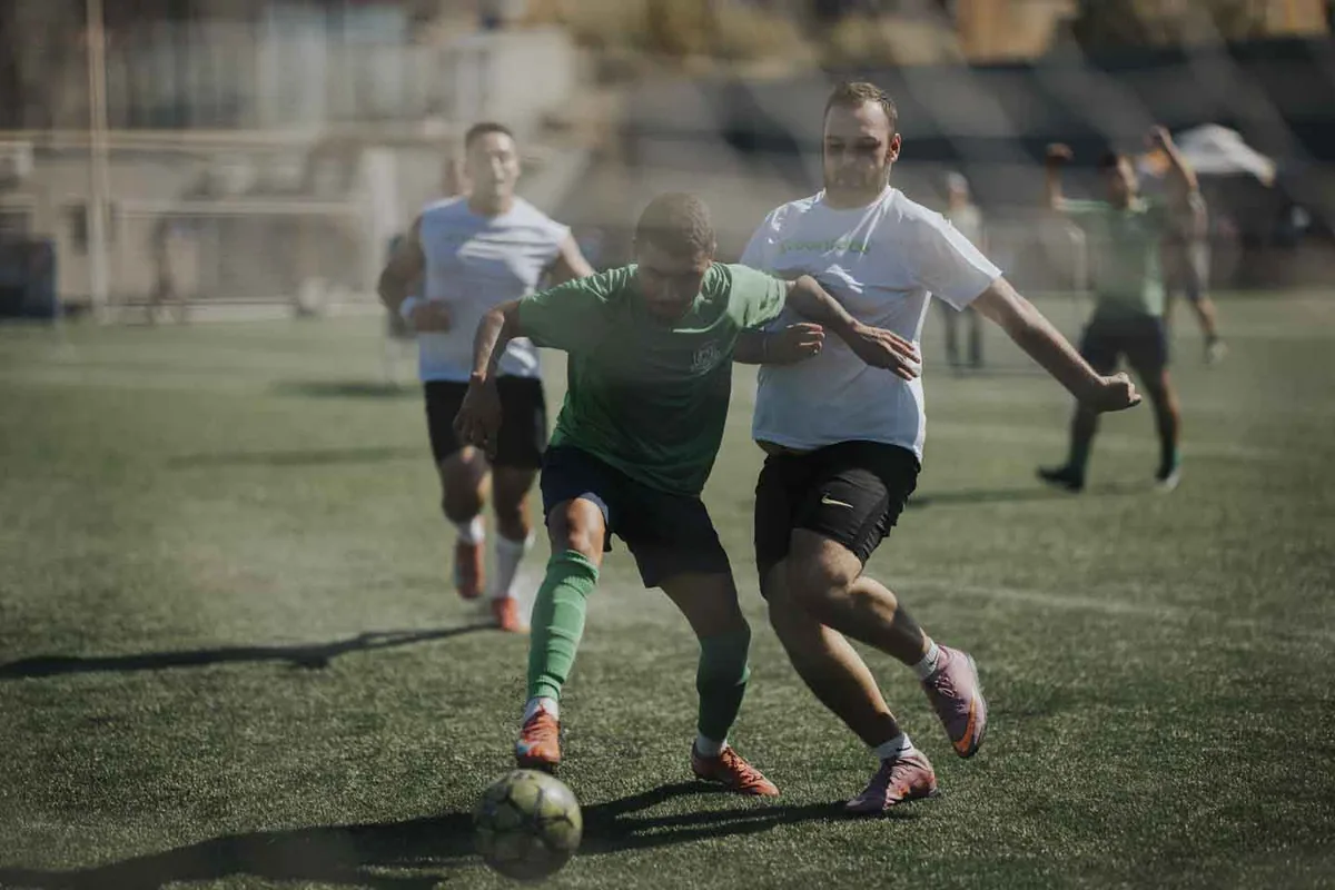 Players in green and white challenge for possession at the 2026 Champions Cup
