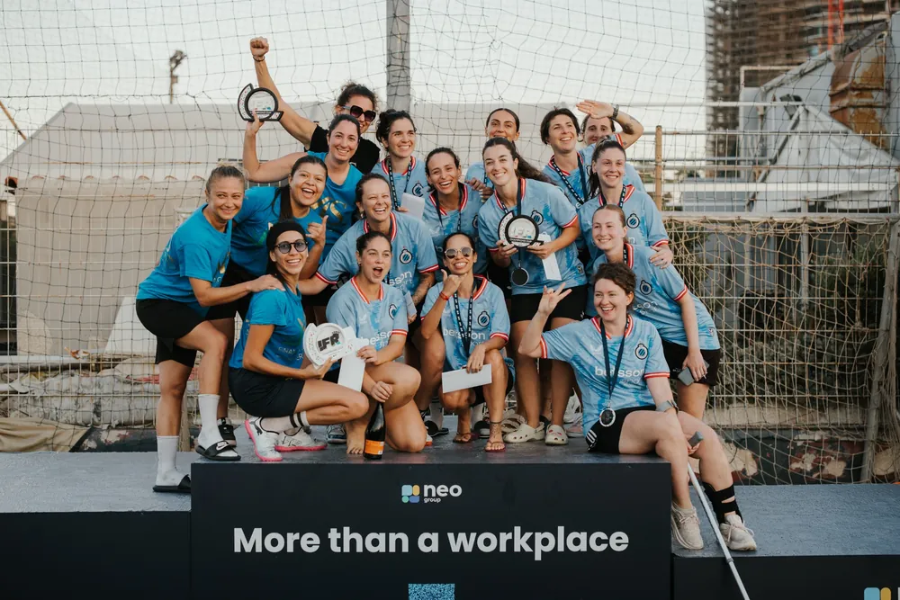 Women’s team celebrating with a trophy at the 2026 IFR Champions Cup