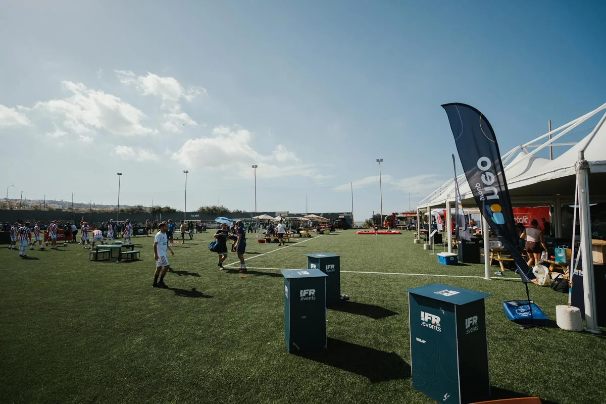 Hospitality tents and guests beside the IFR pitches
