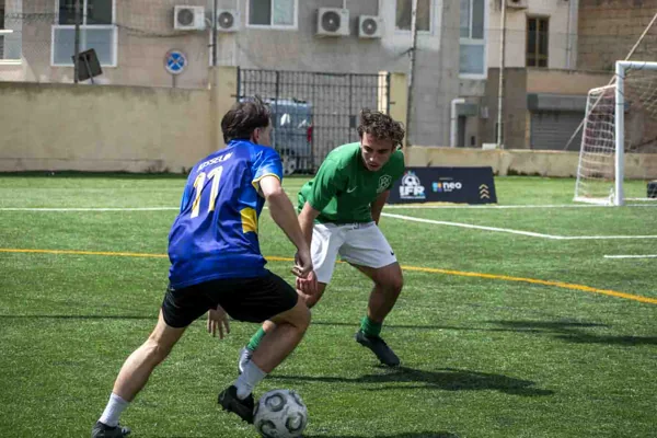 A Neo Group player takes on an Enteractive defender in the 2025/26 IFR League final