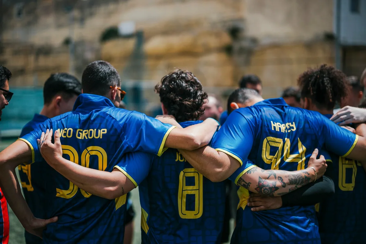 Neo Group players gather in a team huddle at the 2025/26 League finals