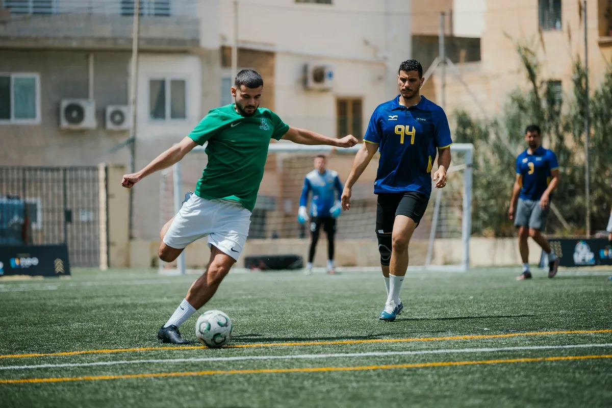 An Enteractive player shoots during the 2025/26 IFR Football League finals