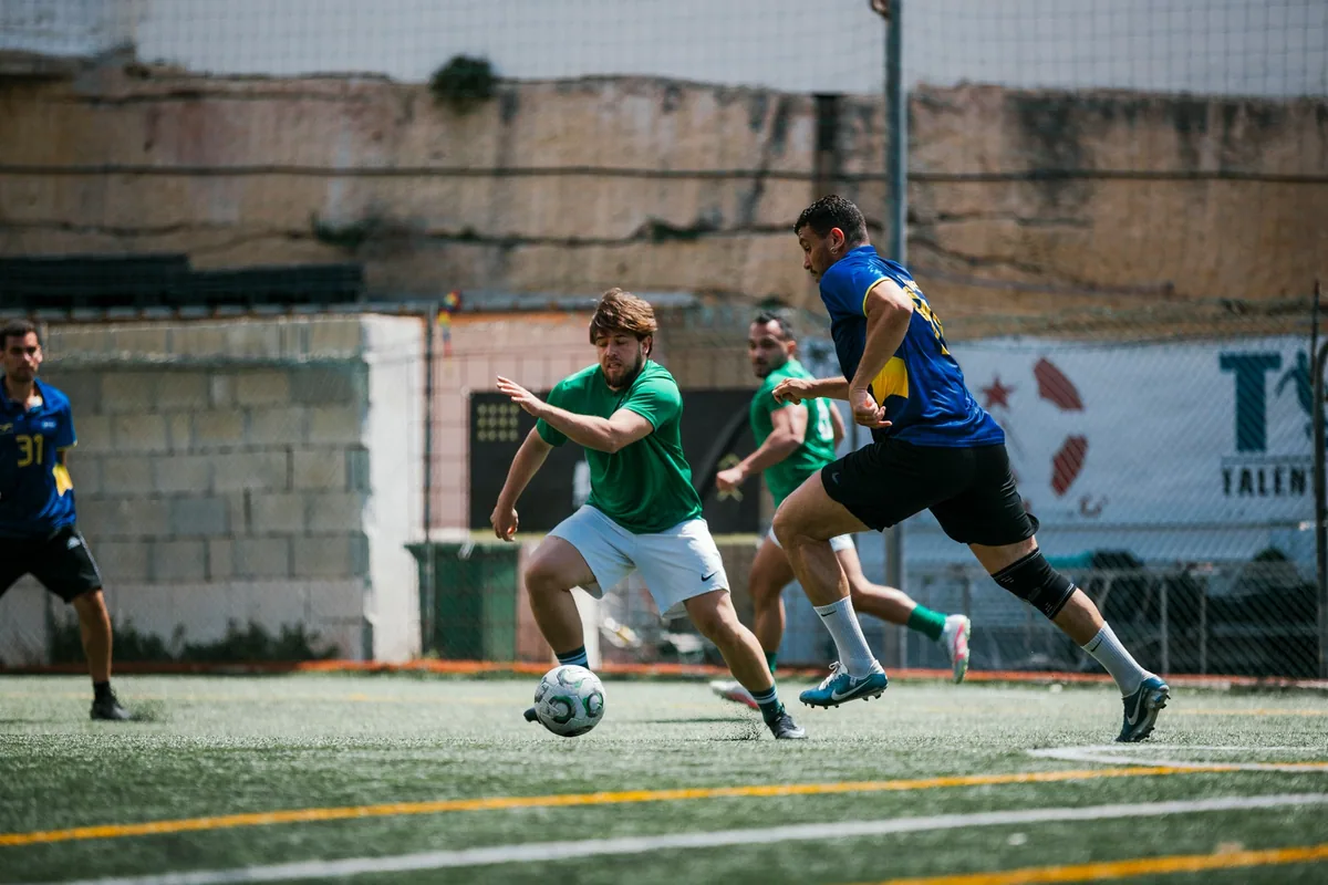 Enteractive and Neo Group contest the ball in the 2025/26 League final
