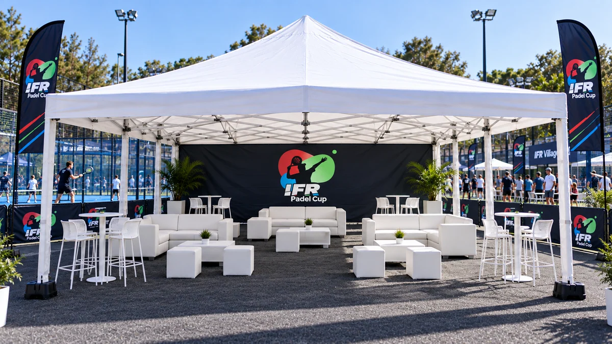 8m × 8m branded lounge with sofas and tables beside the padel courts